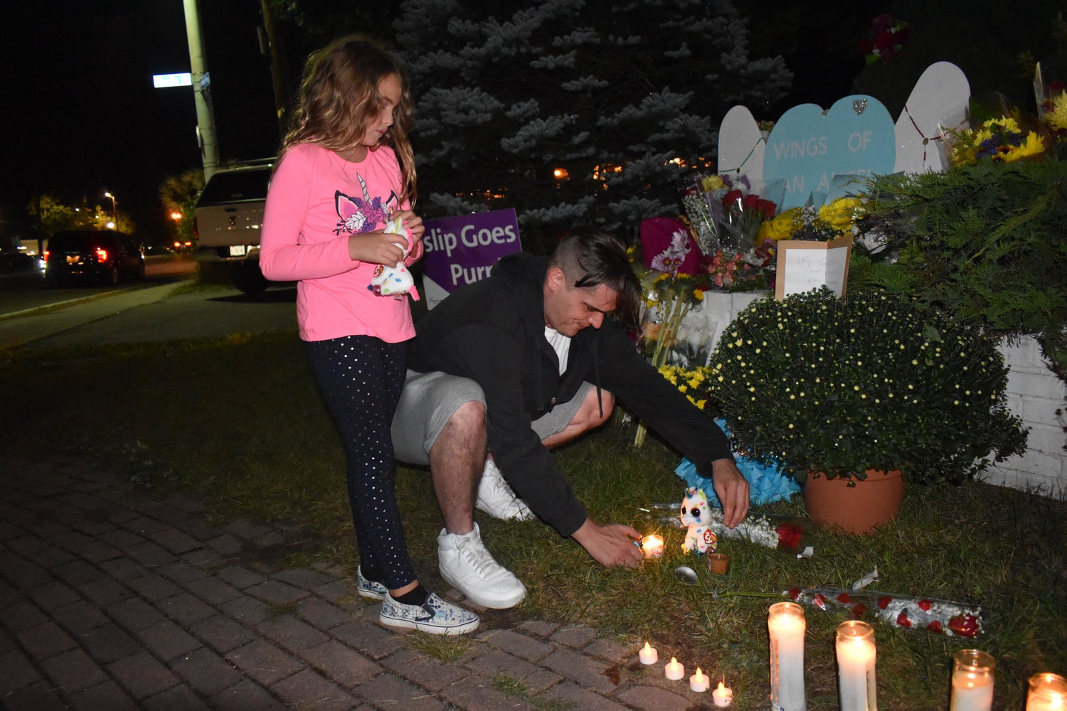 Nick Ferraro and his daughter, Charlotte, picked out unicorn Beanie Boos to leave at the Chamber Park memorial. Charlotte picked up a twin Beanie Boo for herself.